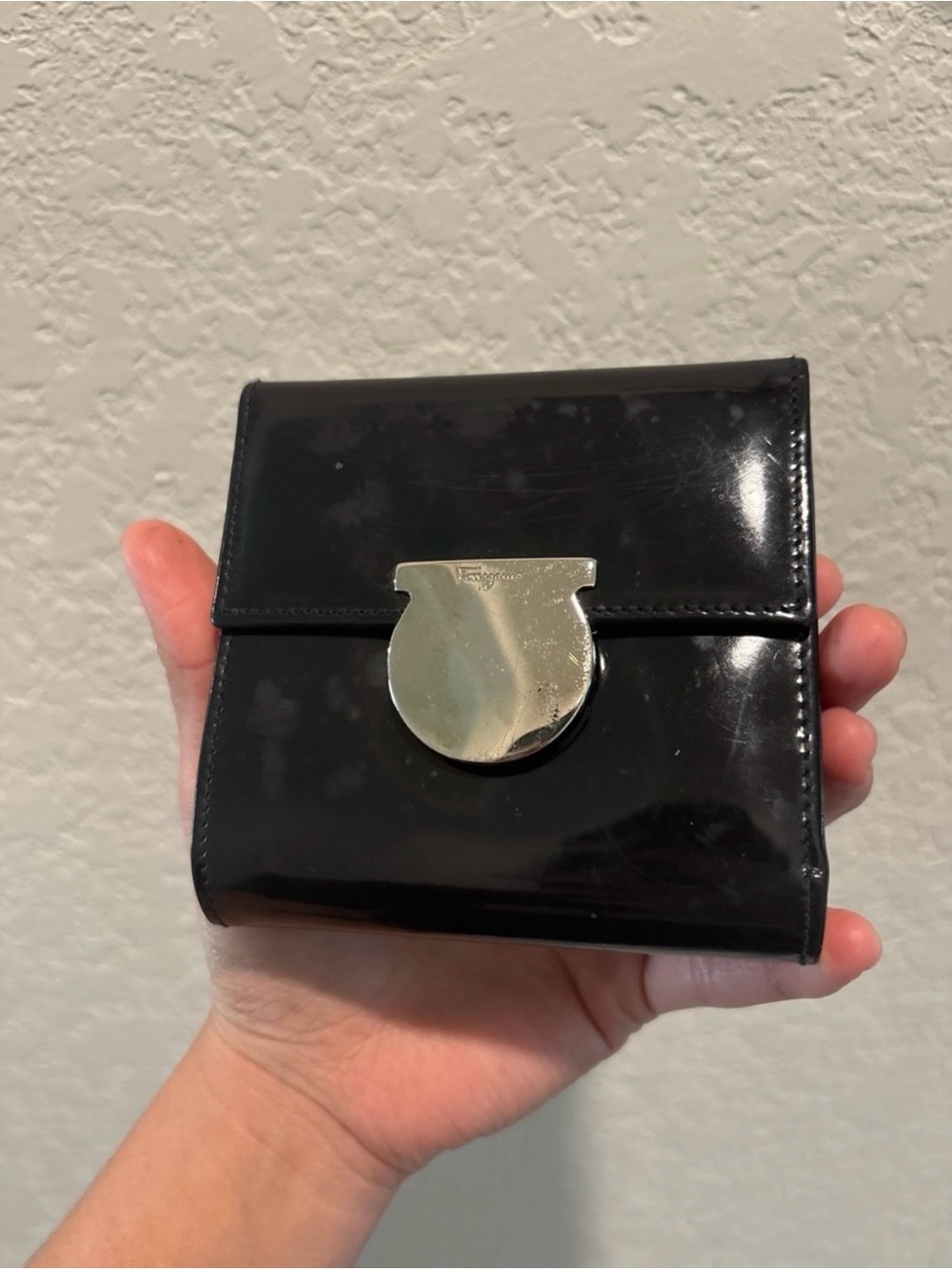 Salvatore Ferragamo Black
Patent Leather Gancini Compact Wallet